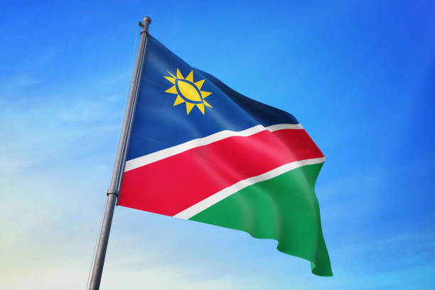 istock Namibia flag waving in the blue sky 1129718777