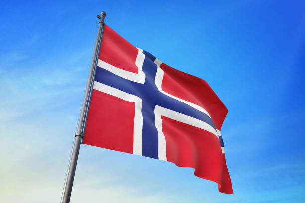 Norway flag waving in the blue sky in the wind