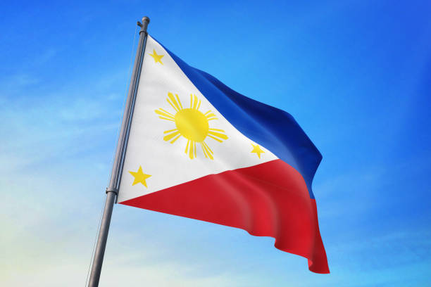 istock Philippines flag waving in the blue sky 1129719910