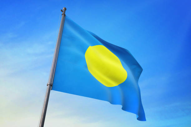 istock Palau flag waving in the blue sky 1129719926
