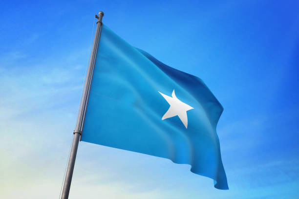 istock Somalia flag waving in the blue sky 1129720149
