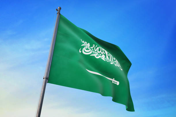 istock Saudi Arabia flag waving in the blue sky 1129720159