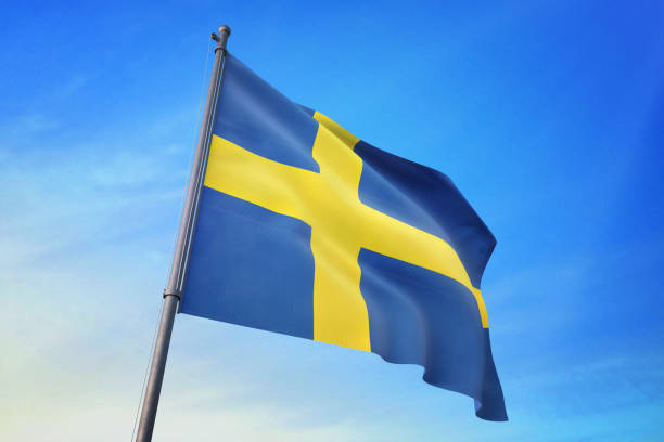 шведский флаг развевается в голубом небе - day sky swedish flag banner стоковые фото и изображения