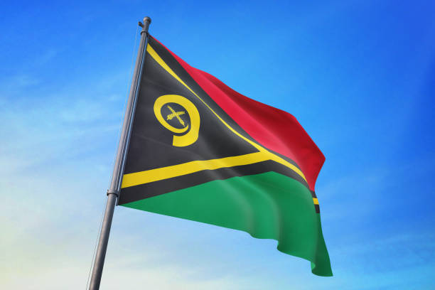 istock Vanuatu flag waving in the blue sky 1129720452