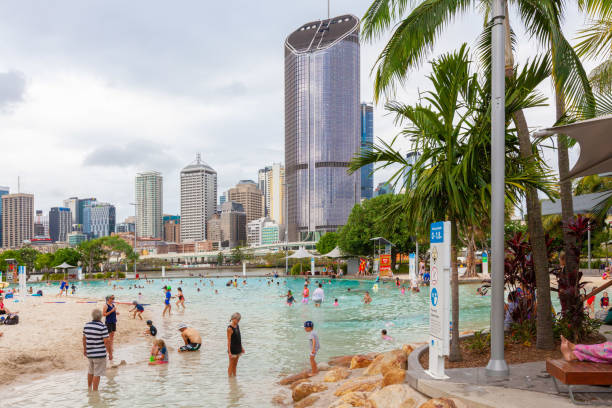 Brisbane, Australia - January 9 2019: People bathing in Streets Beach inner-city, man-made beach