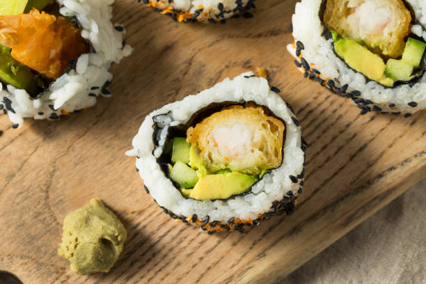 Homemade Shirmp Tempura Sushi Roll Homemade Shirmp Tempura Sushi Roll with Avocados Tempura Prawns stock pictures, royalty-free photos & images
