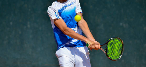 istock Midsection Of Player Playing Tennis 1129731879