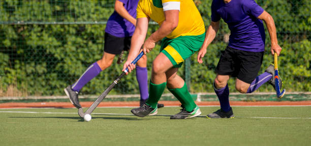 istock Low Section Of Sportsperson Playing Hockey 1129733587