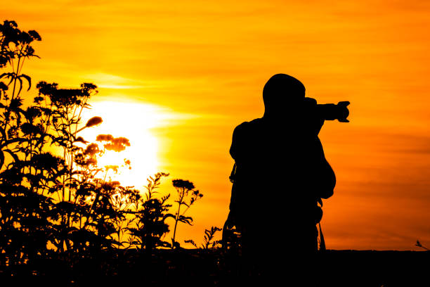 istock Silhouette of a Photographer 1129733968