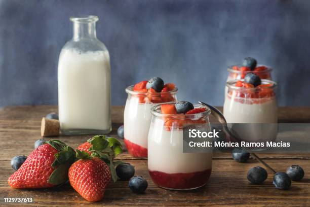Still Life Of Homemade Yogurt With Strawberry Jam And Pieces Of Fruit Stock Photo - Download Image Now