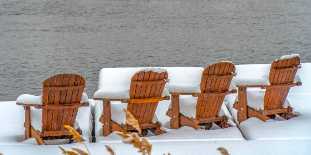 istock Lake deck with chairs on snowy winter day in Utah 1129741633