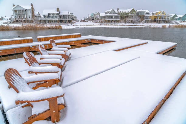 istock Lake deck with chairs covered with snow in winter 1129741667