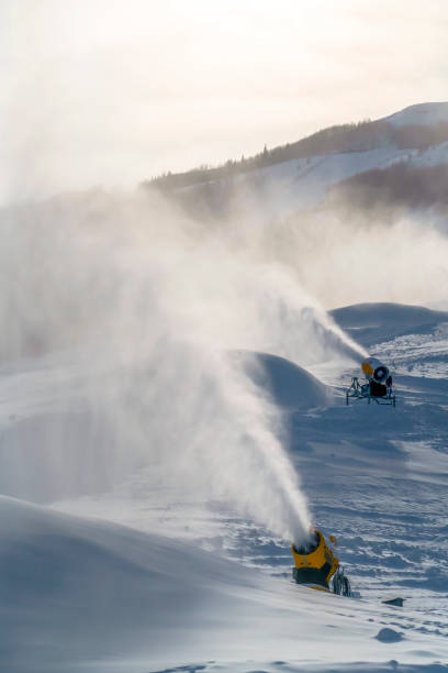 istock Snow cannons against mountain and sky in Utah 1129745444