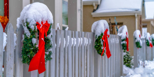 istock Snowy wreaths on picket fence in Daybreak Utah 1129745501