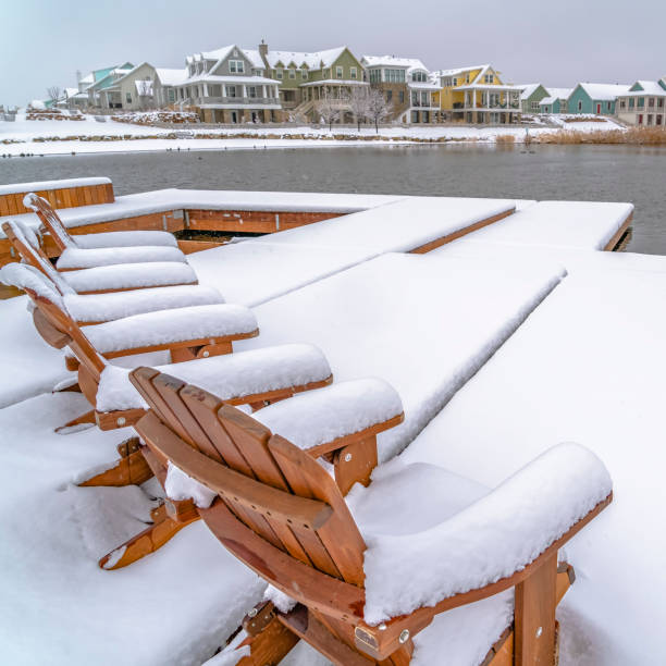 istock Winter in Daybreak Utah with chairs on a lake deck 1129745520