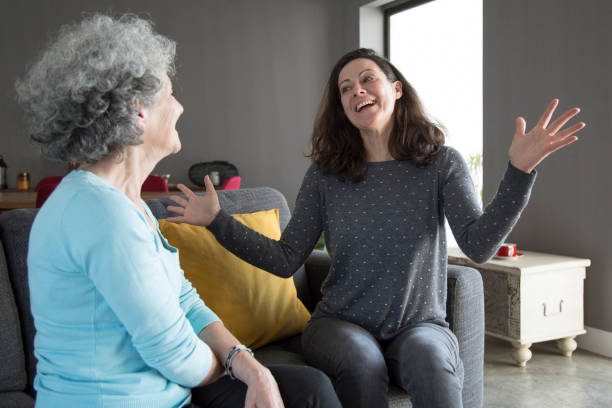 istock Excited lady talking to senior mother and gesturing 1129748623
