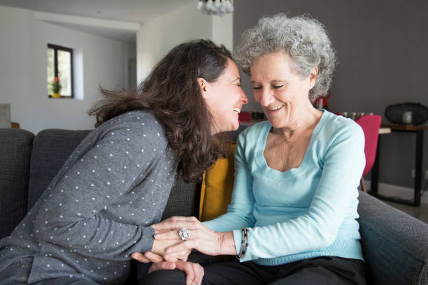 istock Positive elderly woman and her daughter having fun 1129748673