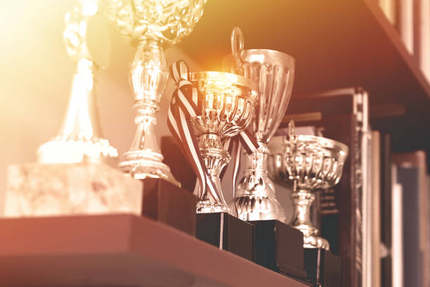 istock Group of Trophies on Shelf 1129750458