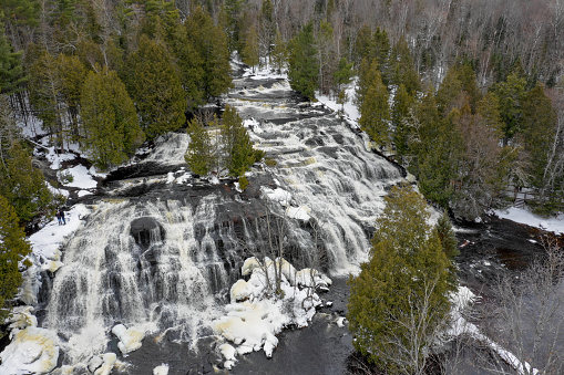 This incredible waterfalls flows all winter long through the winter setting of the Upper Peninsula.  This waterfalls is part of the many waterfalls of Upper Peninsula of Michigan.