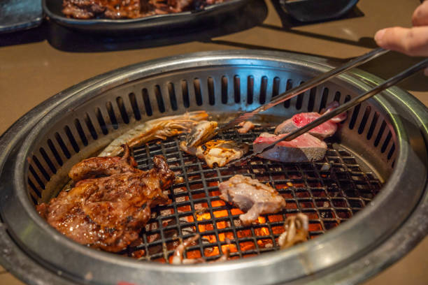 istock Delicious grilled meat and fish on a barbecue buffet 1129764670