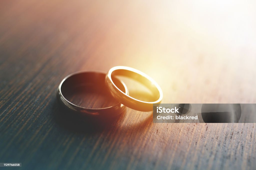 Wedding Rings Close-up of wedding rings on table with sunlight. Wedding Ring Stock Photo