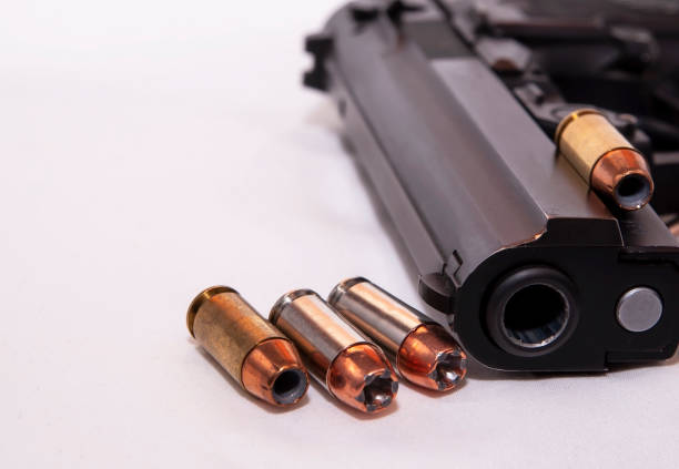 istock A black 40 caliber pistol with four 40 caliber hollow point bullets 1129768110