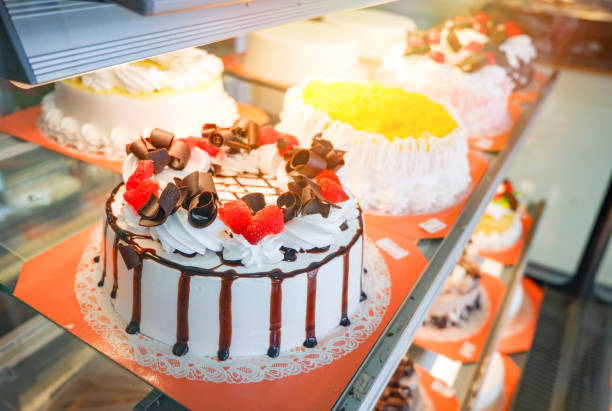 istock Different types Cake tray in showcase glass display at store bakery pastry shop 1129768250