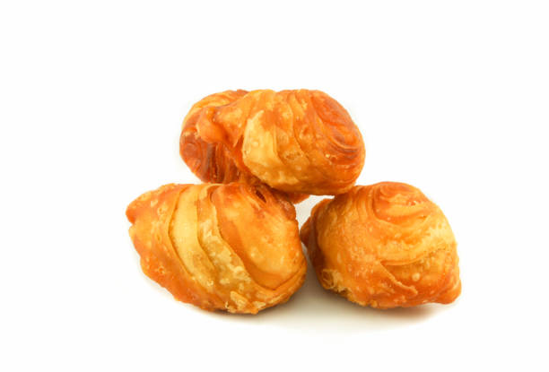 istock Curry puff pastry for snack dessert with beans and sugar isolated on white background 1129768285
