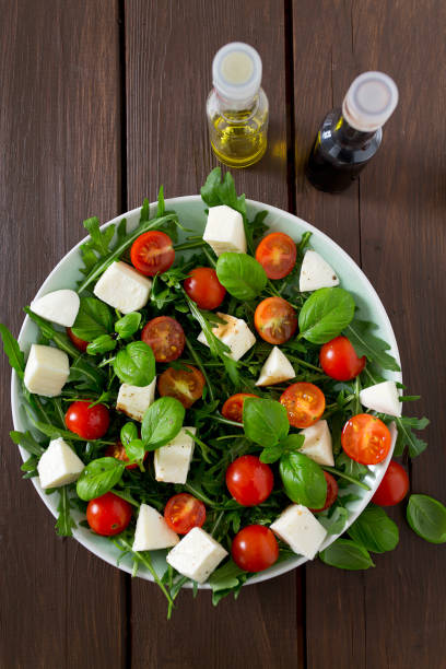 istock Vegetarian salad with cherry tomato, mozzarella and rucola 1129775307