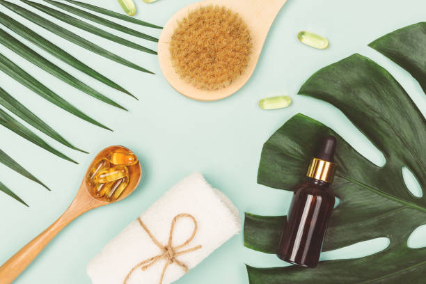 istock Tropical leaves, essential oil, fish oil capsules 1129780415