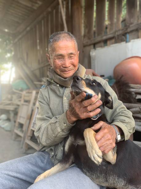 istock Rural Farmer with dog 1129780417