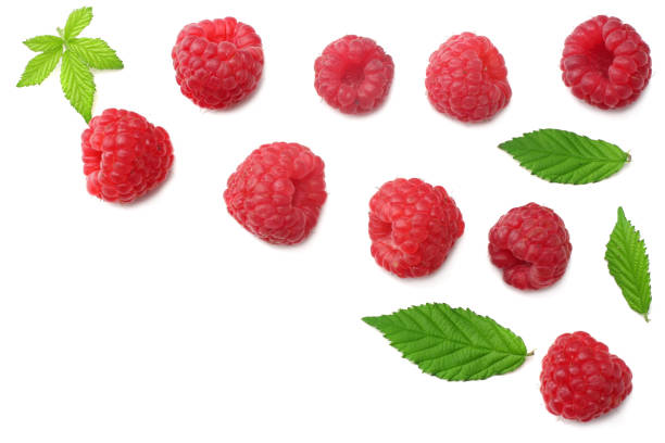 istock ripe raspberries with green leaf isolated on white background. top view 1129780843