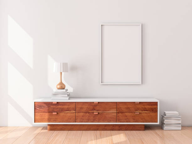 istock White Poster Frame hanging on the wall, modern bureau with Table lamp and books 1129786764