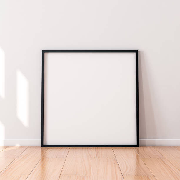 istock Square Poster with Black wooden Frame Mockup standing on the floor 1129786769