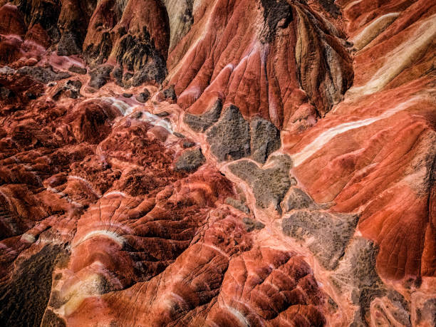 Zhangye Rainbow mountains Aerial top down view on Zhangye Rainbow mountains displaying colorful pattern danxia landform stock pictures, royalty-free photos & images