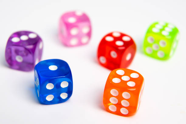istock Dice of different colors isolated on a white background. 1129787977
