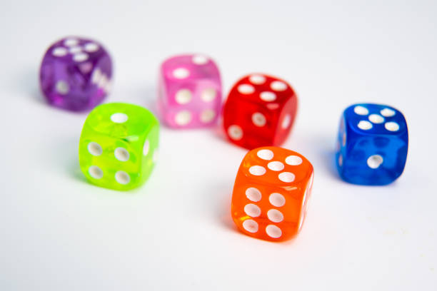 istock Dice of different colors isolated on a white background. 1129787999