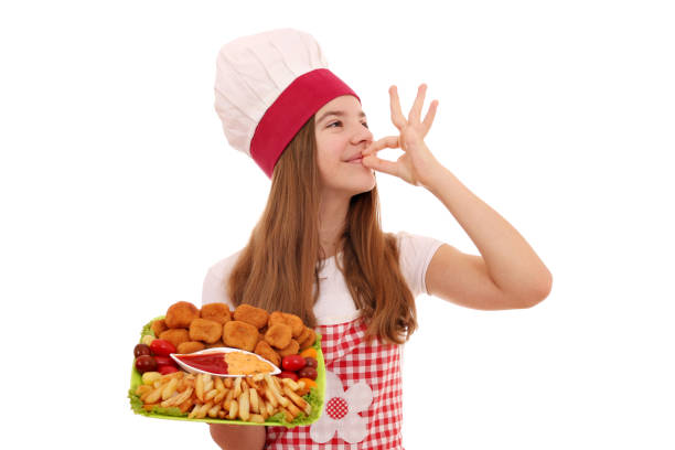Happy girl cook with chicken nuggets and ok hand sign Happy girl cook with chicken nuggets and ok hand sign nugget photos stock pictures, royalty-free photos & images