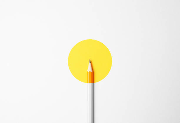 Yellow pencil on a white background, minimalism. Abstract art, imagination, education
