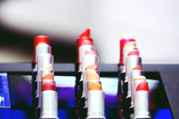istock Colorful lipsticks tester on shelves for background 1129792299