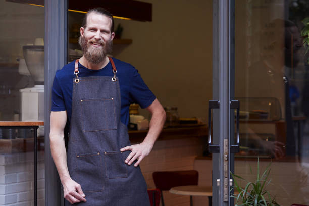 istock Barista portrait in store front. 1129793262