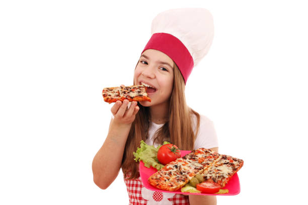istock hungry girl cook eats sandwich 1129793314
