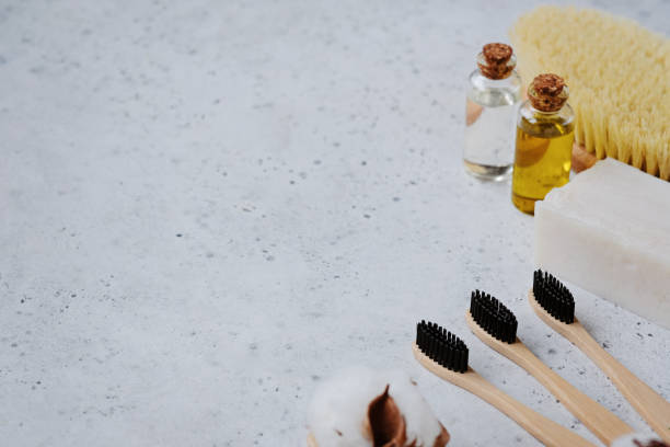 istock Plastic free products and bamboo toothbrush - creative layout on grey background. Eco natural skin care concept. 1129793525