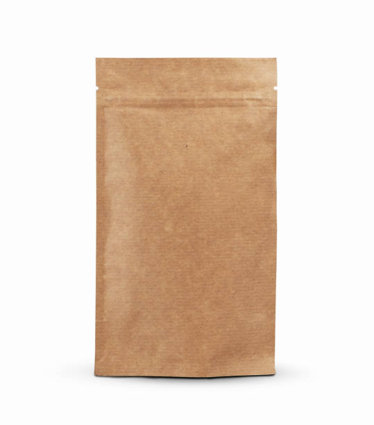 istock Brown paper food package bag isolated on white background. 1129793643