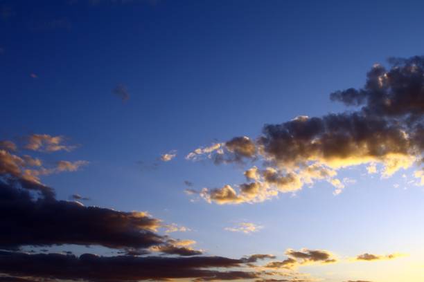 istock pretty colorful sunset or sunrise cloudy sky for using in design as background. 1129794271