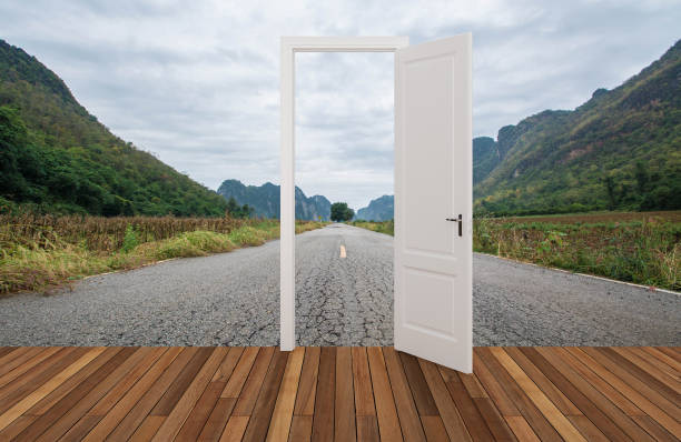 istock Landscape behind the opening door 1129794424