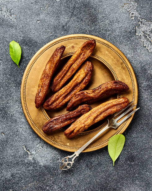 istock Dried bananas on gray background. Top view. 1129796258
