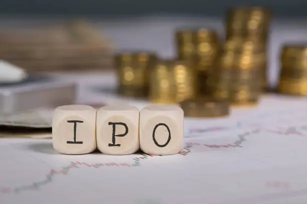 Photo of Abbreviation IPO composed of wooden letters.