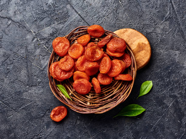 istock Dried apricots on gray background with copy space. Top view. 1129797169