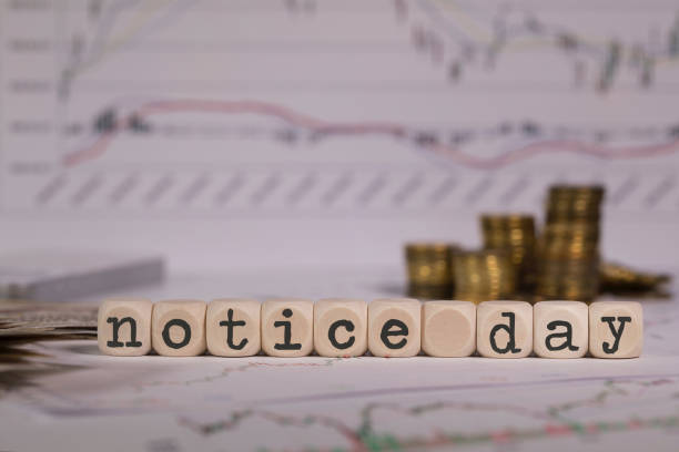 Words NOTICE DAY composed of wooden letters. Words NOTICE DAY composed of wooden letters. Stacks of coins in the background. Closeup gold ira companies explained stock pictures, royalty-free photos & images